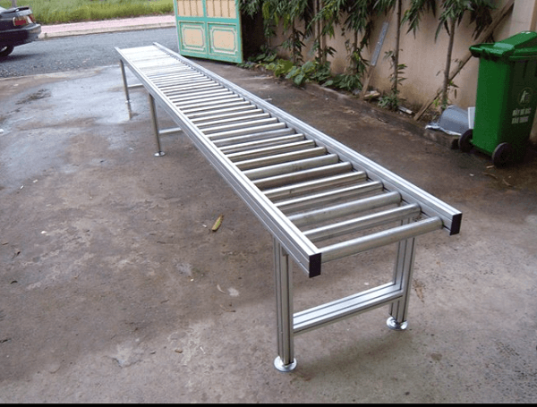 Ứng Dụng Nổi Bật Của Băng Tải Con Lăn Nhôm Trong Công Nghiệp